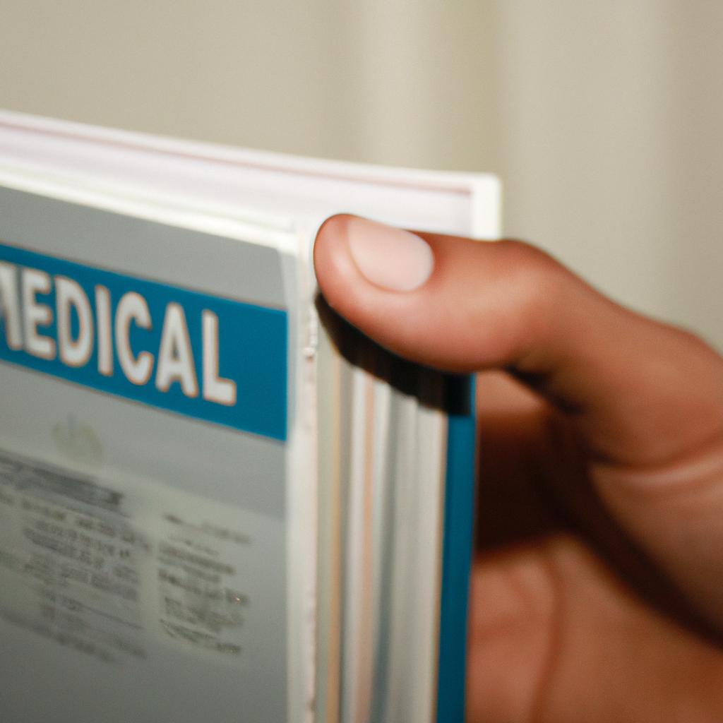 Person holding medical information booklet